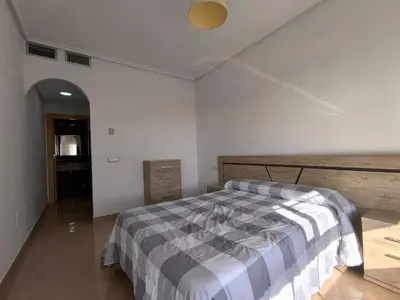 Cama o camas de una habitación en APARTAMENTO TURISTICO 2ºE CARLOS III - Cerca de la playa