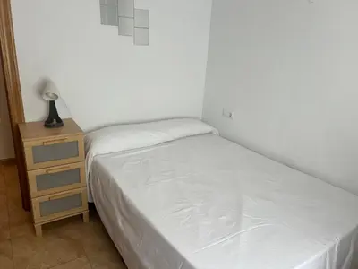 Cama o camas de una habitación en tuAnfitrion Almería Beach I