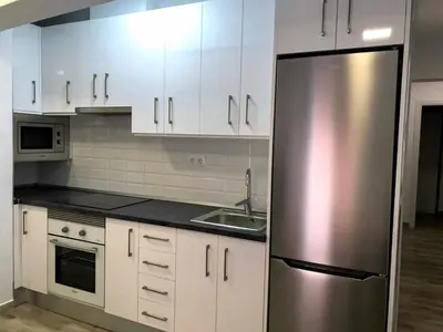 Una cocina o zona de cocina en tuAnfitrion Almería Beach II