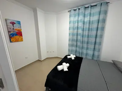 Cama o camas de una habitación en Apartamento Moderno junto al Paseo y playa en Garrucha 2A