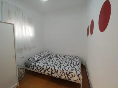 Cama o camas de una habitación en Al-Mariyya Centro Ciudad