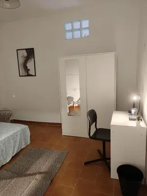 Cama o camas de una habitación en Al-Mariyya Centro Ciudad