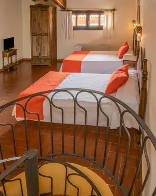 Cama o camas de una habitación en Hospederia del Zenete