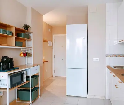 Una cocina o zona de cocina en Duna Suite con terraza y vistas al mar, piscina y playa a 7 min caminando