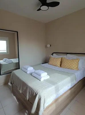 Cama o camas de una habitación en Duna Suite con terraza y vistas al mar, piscina y playa a 7 min caminando