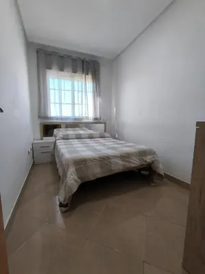 Cama o camas de una habitación en APARTAMENTO TURISTICO 3ºA CARLOS III - Cerca de la playa