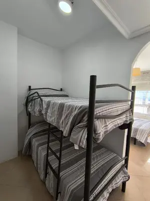 Cama o camas de una habitación en APARTAMENTOS TURISTICOS 3ºD CARLOS III - Cerca de la playa