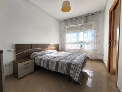 Cama o camas de una habitación en APARTAMENTOS TURISTICOS 4ºD CARLOS III - Cerca de la playa