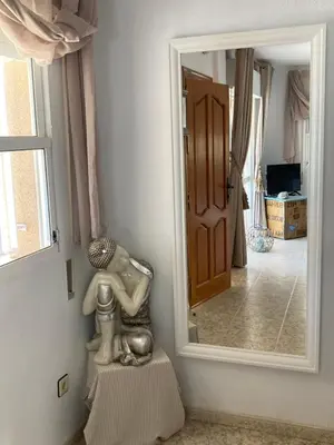 Una televisión o centro de entretenimiento en Casa Del Mar