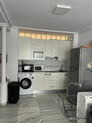 Una cocina o zona de cocina en Acogedor al lado de el mar