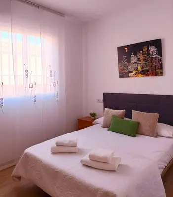 Cama o camas de una habitación en Cala Grande suites 3 hab, vistas al mar y terraza