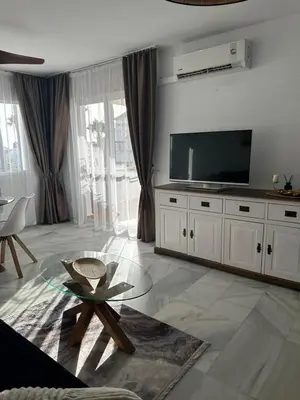Una televisión o centro de entretenimiento en Apartment in Golf Playa Residences