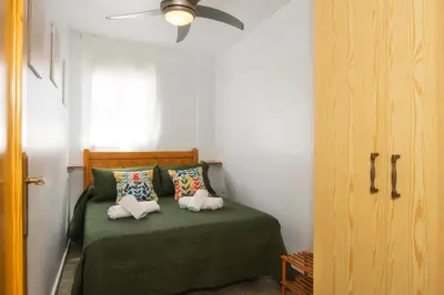 Cama o camas de una habitación en Apartamento céntrico Belquimar a pocos pasos de la playa