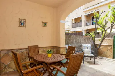 Un balcón o terraza de Vera Playa Chalet Adosado Jardín Piscina Parking