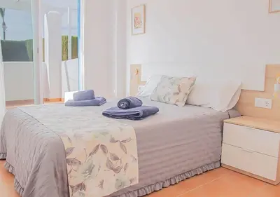 Cama o camas de una habitación en MojacarProperty Noalejo Beach Apartment