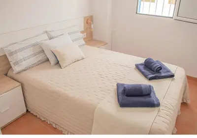 Cama o camas de una habitación en MojacarProperty Noalejo Beach Apartment