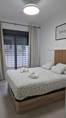 Cama o camas de una habitación en Gran terraza Apartamento playa Garrucha