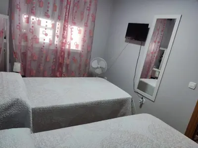 Cama o camas de una habitación en piso avda sabinal con piscina