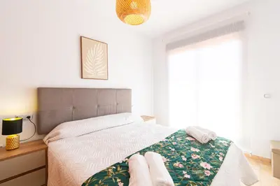 Cama o camas de una habitación en Apartamento con terraza y piscina en Los Collados - By Aloha Palma