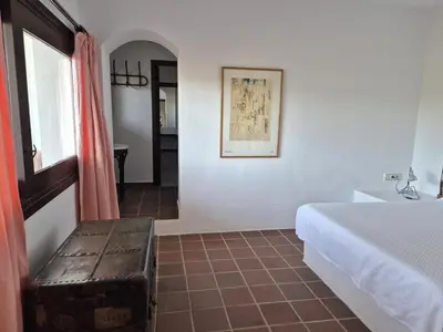 Cama o camas de una habitación en El Palmeral