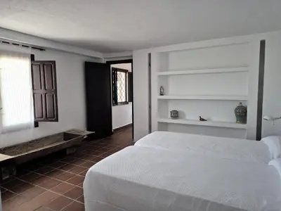 Cama o camas de una habitación en El Palmeral