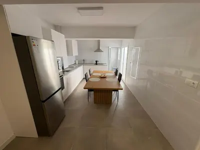 Una cocina o zona de cocina en apartamento san urbano