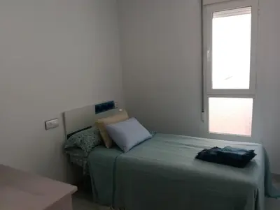 Cama o camas de una habitación en Rolex el Toyo-Retamar
