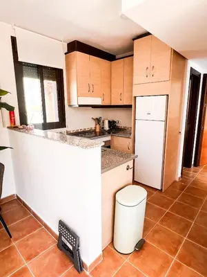Una cocina o zona de cocina en Apartamento con acogedora terraza