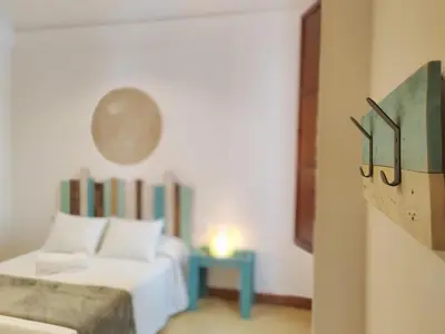 Cama o camas de una habitación en Apartamentos Bertrand Plaza