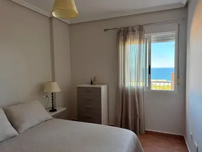 Cama o camas de una habitación en Atico con vistas al mar