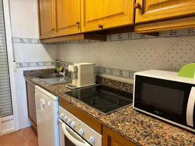 Una cocina o zona de cocina en Atico con vistas al mar
