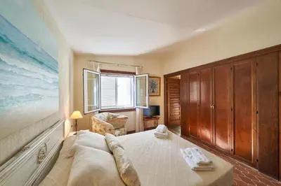 Cama o camas de una habitación en El Palomar