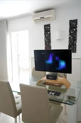 Una televisión o centro de entretenimiento en El nido marino - Pequeño chalet frente al mar