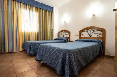 Cama o camas de una habitación en Hotel Apartamentos Mojácar Beach