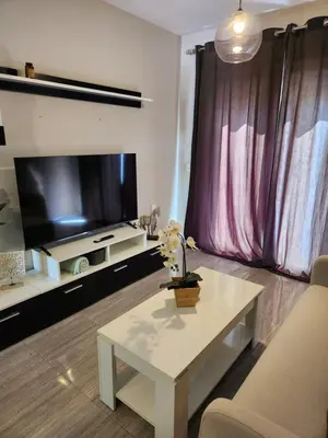 Una televisión o centro de entretenimiento en Ático Boutique con Piscina privada en el Solárium y Diseño Natural