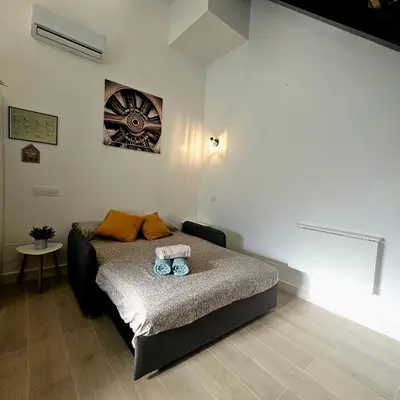 Cama o camas de una habitación en Encantador apartamento y terraza