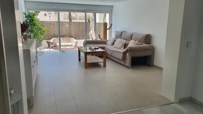 Zona de estar de Precioso bajo en El Toyo