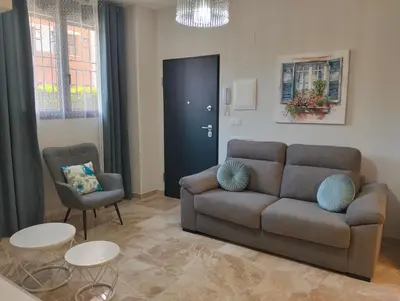 Zona de estar de APARTAMENTO SOL - 2 apartamentos céntricos juntos cerca de la playa, ideales para grupos grandes