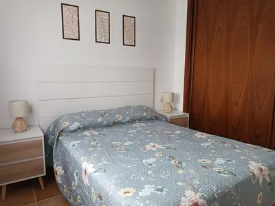 Cama o camas de una habitación en Apartamento Vera playa, Entre Sol y Salinas