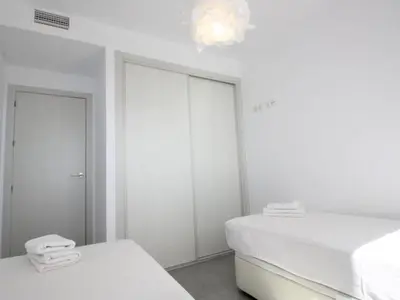 Cama o camas de una habitación en Apartamento encantador con piscina comunitaria en San Juan de los Terreros - ES-376-17