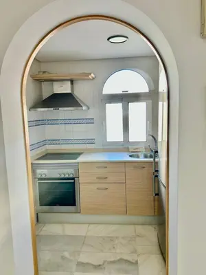 Una cocina o zona de cocina en Expoholidays - Coqueto apartamento Puerto Deportivo