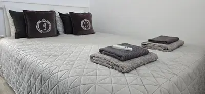 Cama o camas de una habitación en Apartamentos playa Romanilla