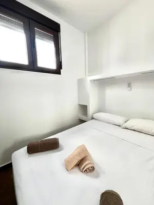 Cama o camas de una habitación en Frente a la ISLA