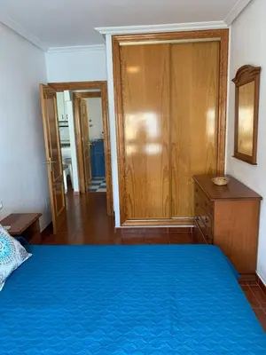 Cama o camas de una habitación en Apartamentos La Almadraba 1-5