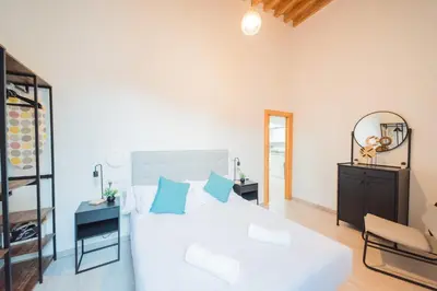 Cama o camas de una habitación en Apartamentos San Francisco con Terraza privada by Expoholidays