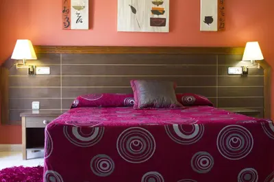Cama o camas de una habitación en Hotel la Parrilla