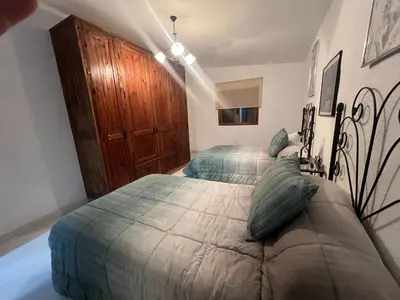 Cama o camas de una habitación en Casa -Cueva Paraje De Los Majuelos