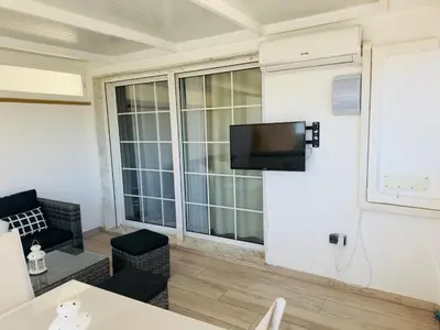 Una televisión o centro de entretenimiento en Grazaries 2 -Apartamento Playa Serena Roquetas-