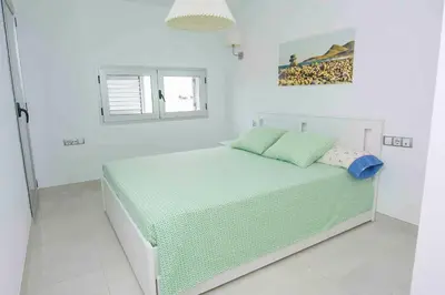Cama o camas de una habitación en Cadre exceptionnel Appartement les pieds dans l'Eau Mer Piscine Clim Terrasse Vue Mer