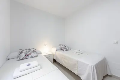 Cama o camas de una habitación en AlmeriaSuite Sabinar Beach